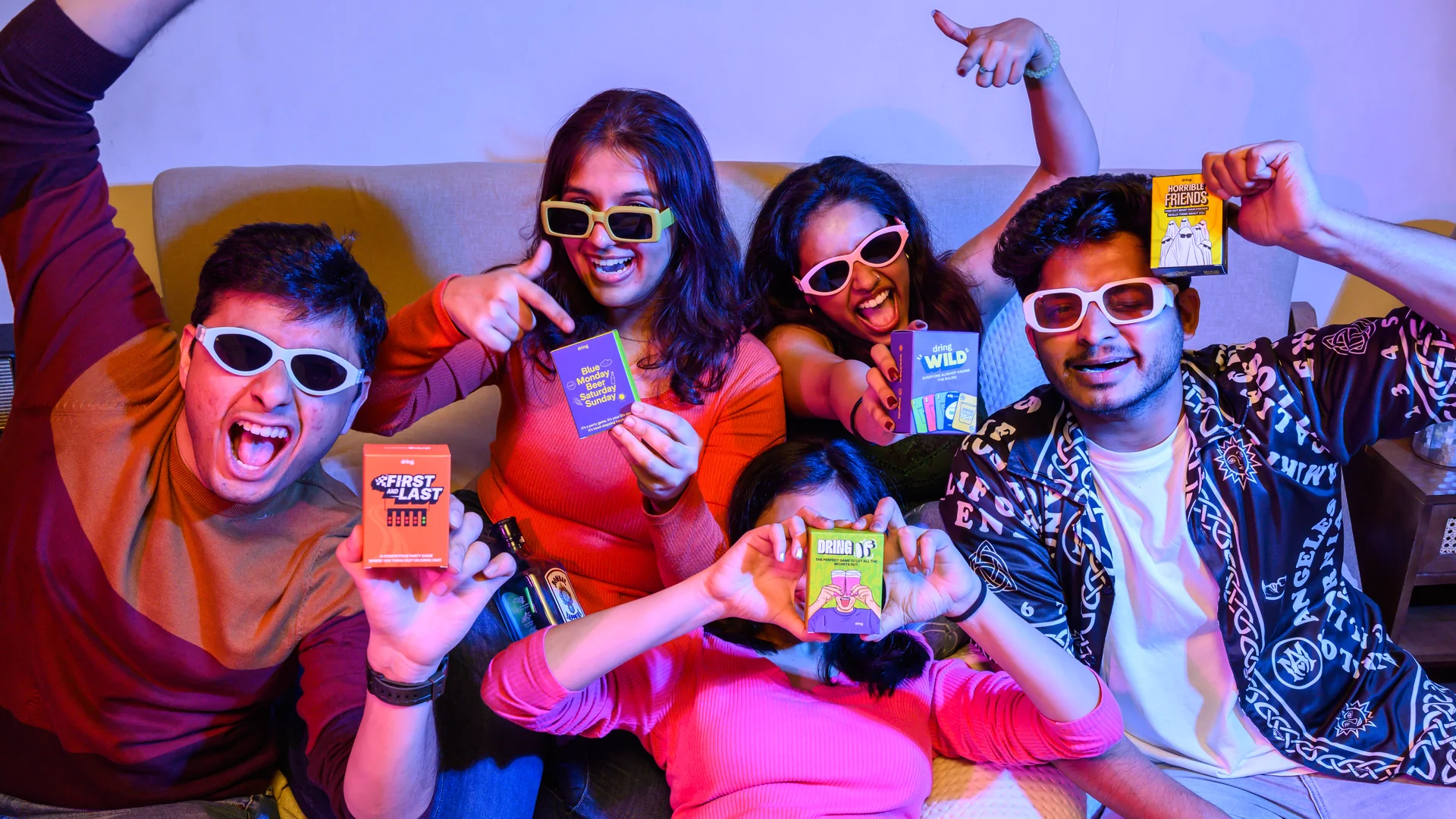 Dring party card games, including First & Last, at a house party