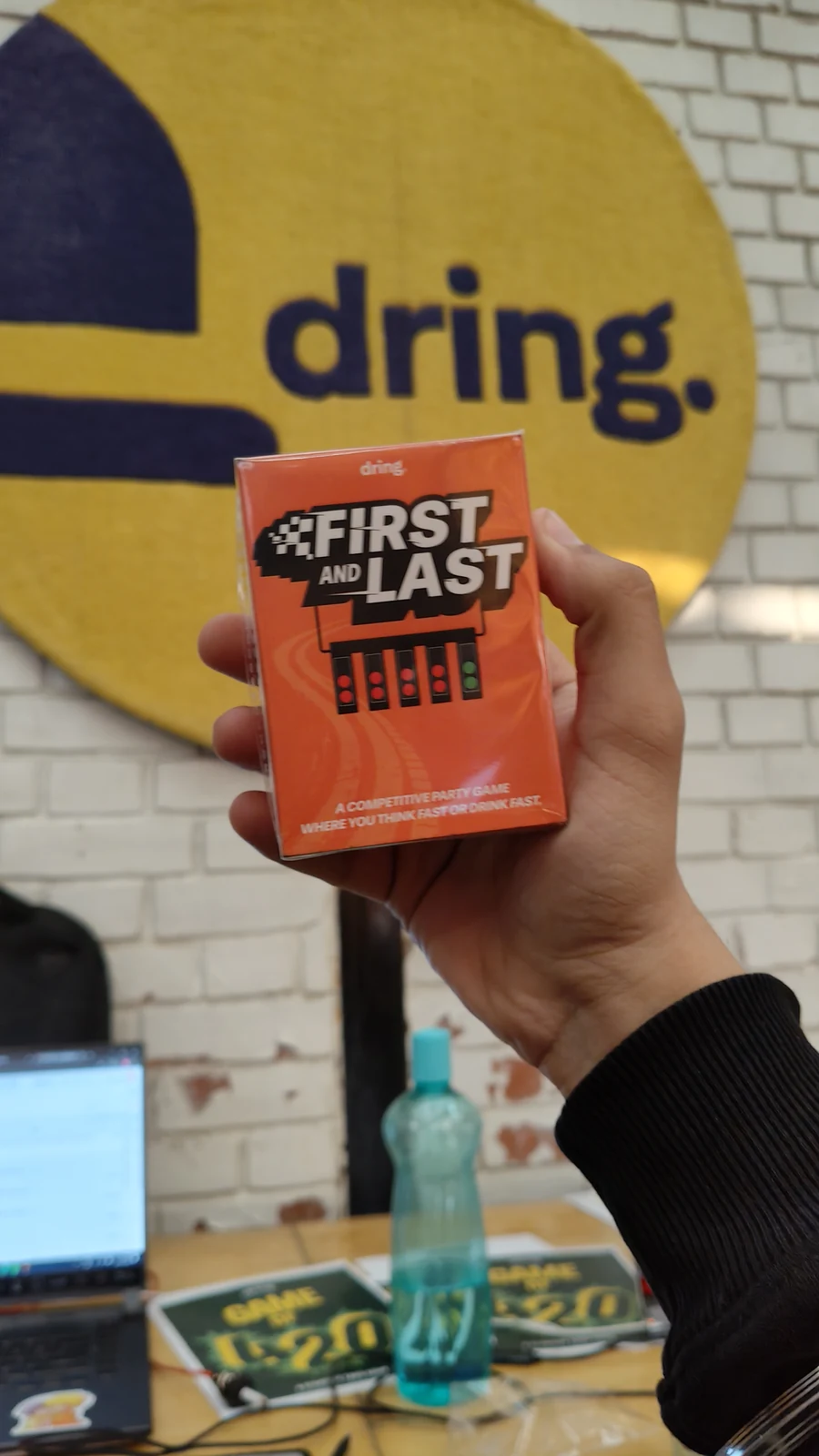 First & Last box in front of the Dring studio wall