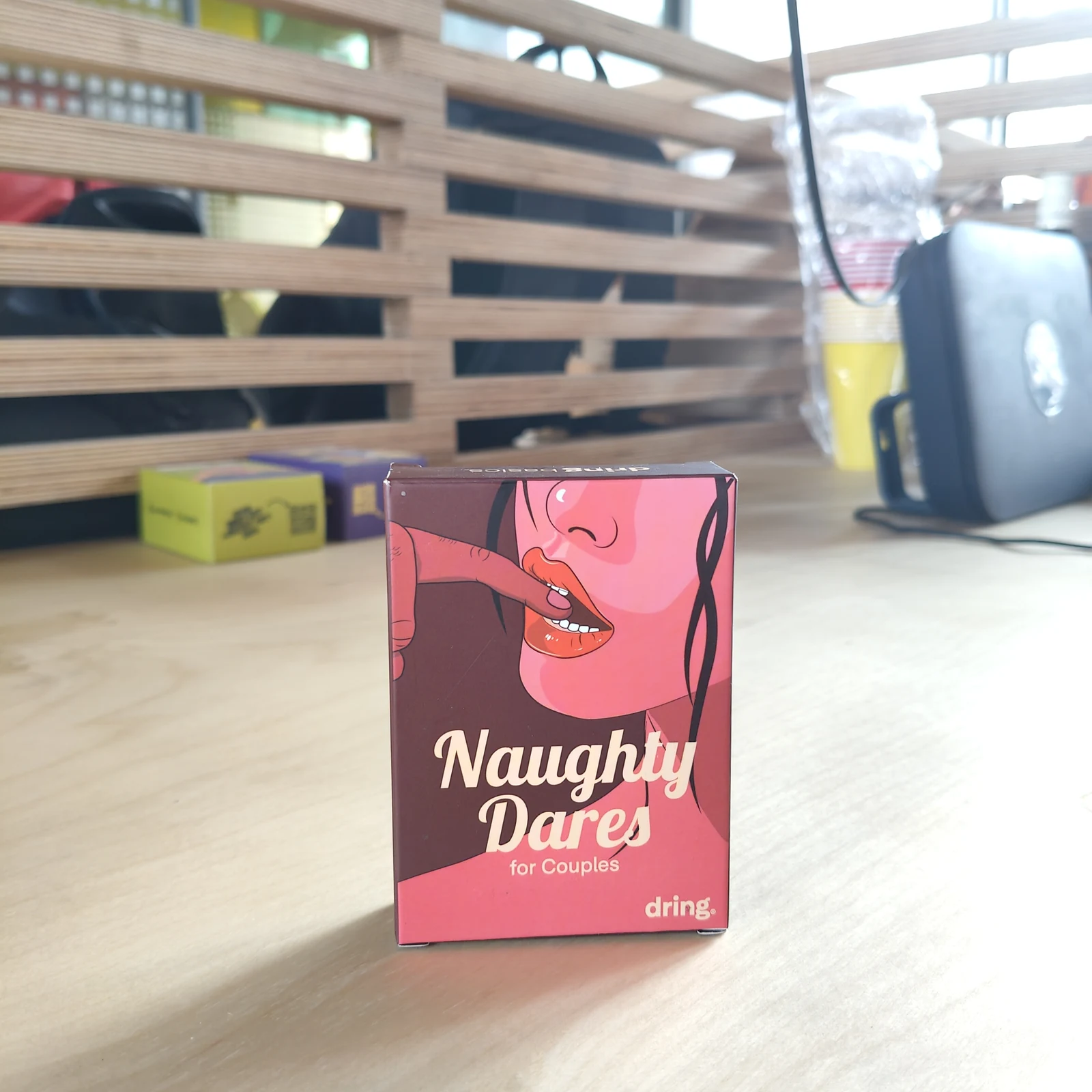 Naughty Dares box on a workshop table